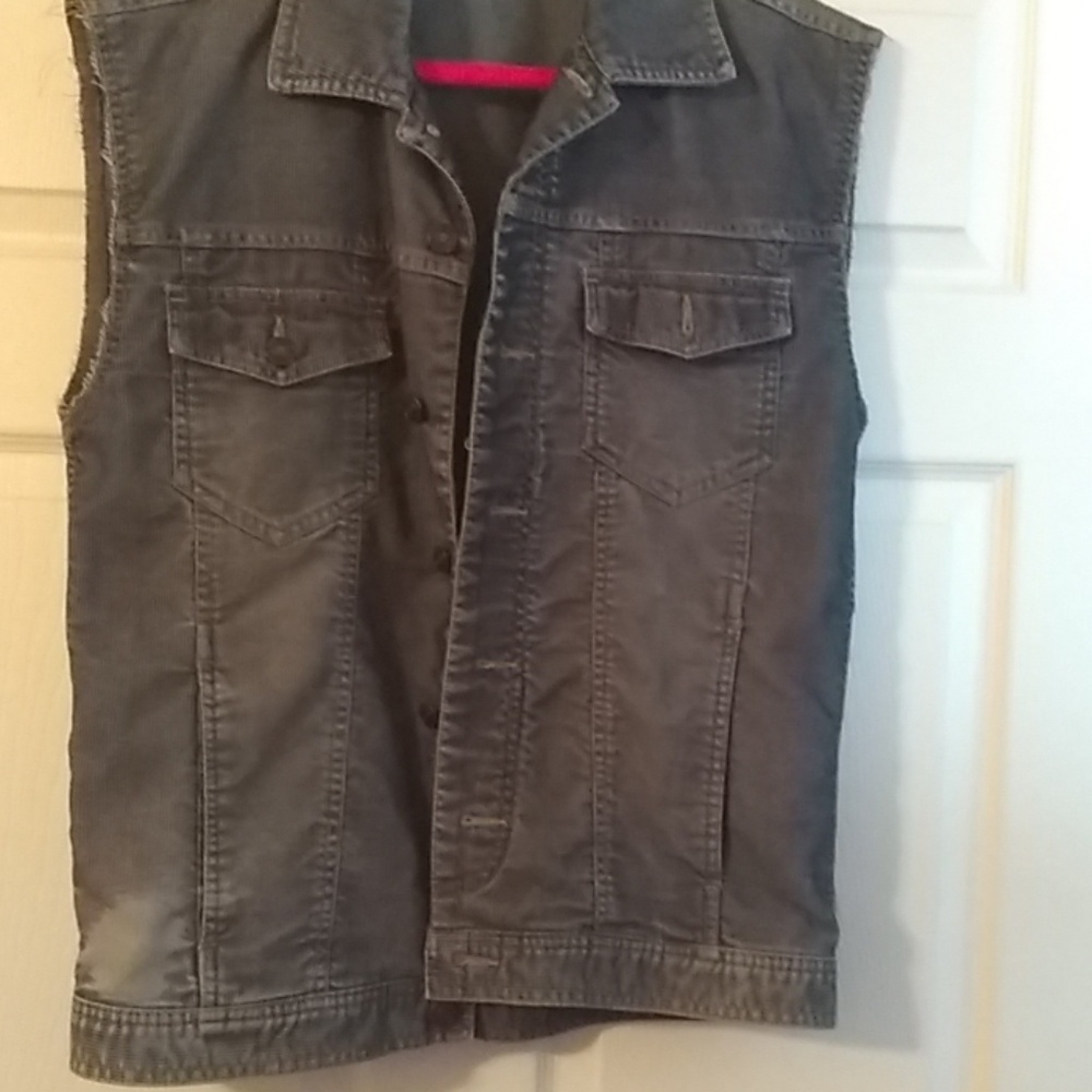 Grey vest worn